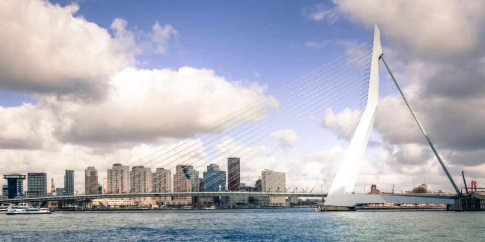 A photo of the Erasmus Bridge in Rotterdam on a sunny day.