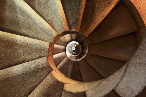 A photo of a staircase which has a round shape.